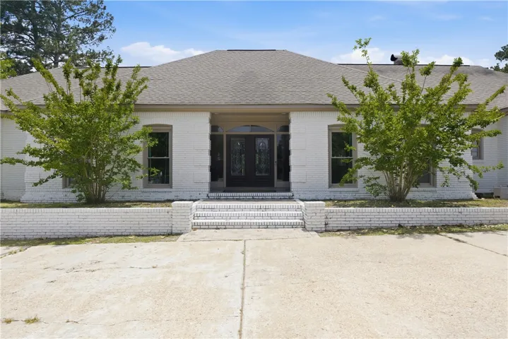 A classic brick exterior with a welcoming entry and prominent architectural details.