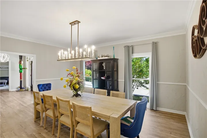 A spacious dining area showcases crown molding and generous natural light.