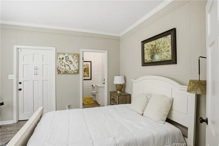 Comfortable sleeping quarters provide a tranquil retreat within this home.