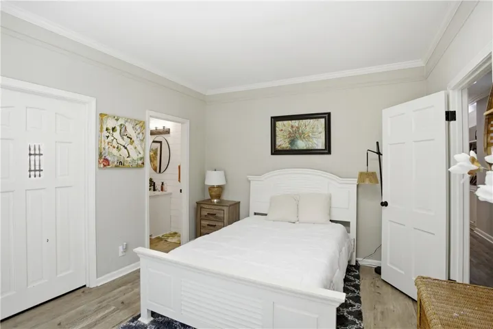 Clean lines and wood-look flooring create a comfortable retreat.