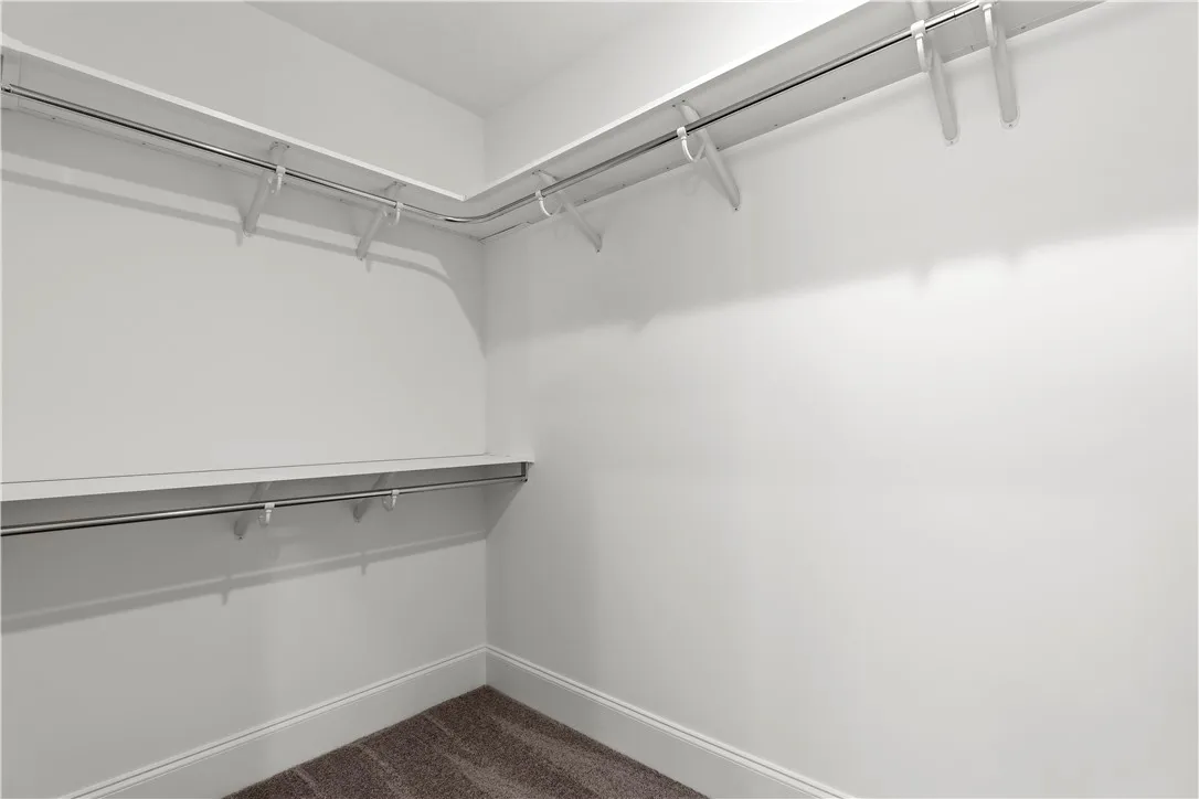 Ample hanging space and shelving create an organized closet for all your storage needs.