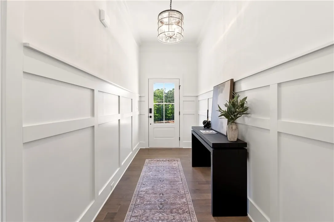 Board and batten detailing adds depth and character to this inviting entrance foyer.
