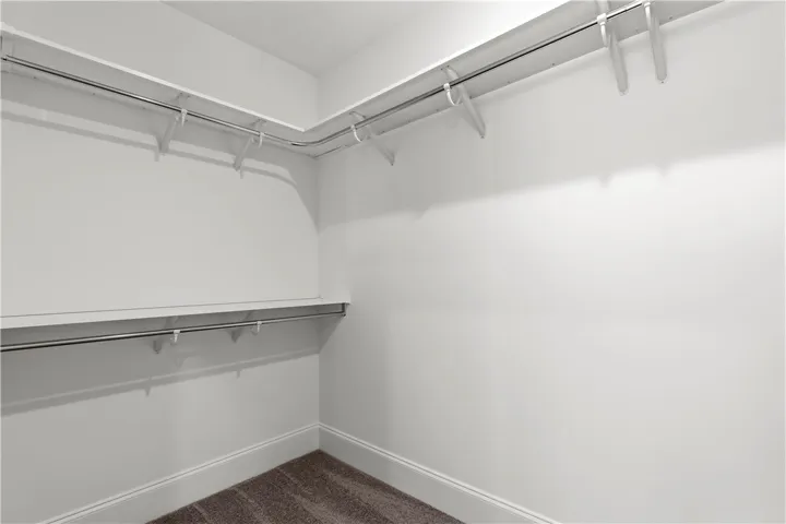 Ample hanging space and shelving create an organized closet for all your storage needs.