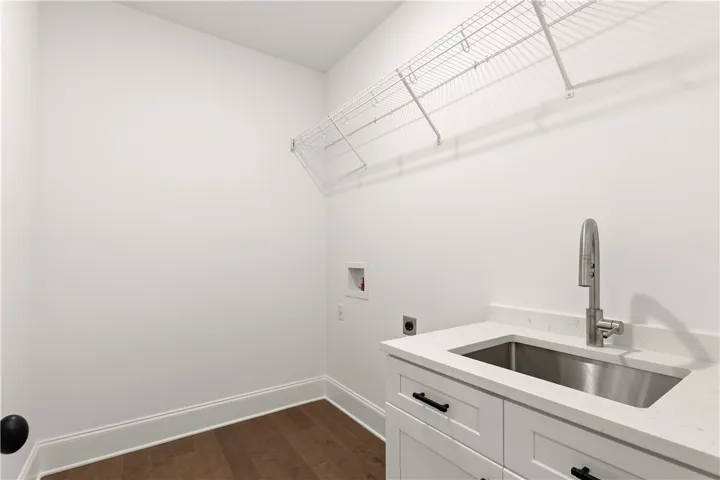 A streamlined laundry room provides practical space for household tasks.