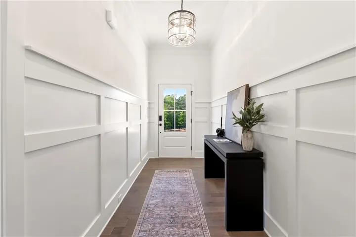Board and batten detailing adds depth and character to this inviting entrance foyer.