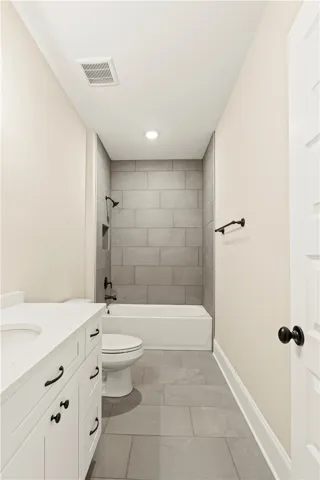 Clean lines and a functional design define this contemporary full bathroom.