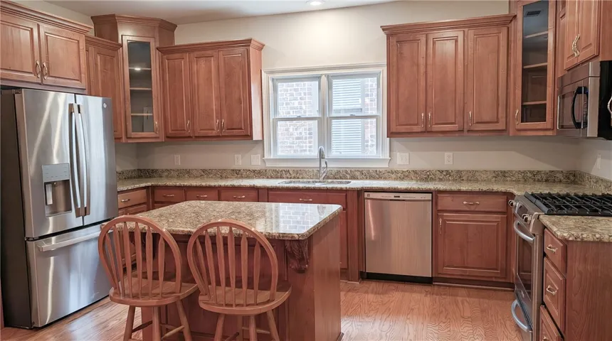 Large kitchen offers a central island with seating in addition to a spacious breakfast area.