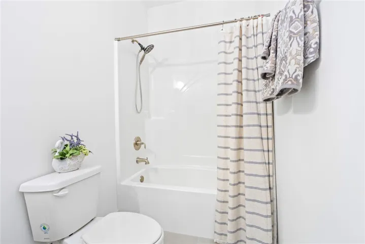 A well-appointed bath features a shower-tub combination and modern fixtures for daily comfort.