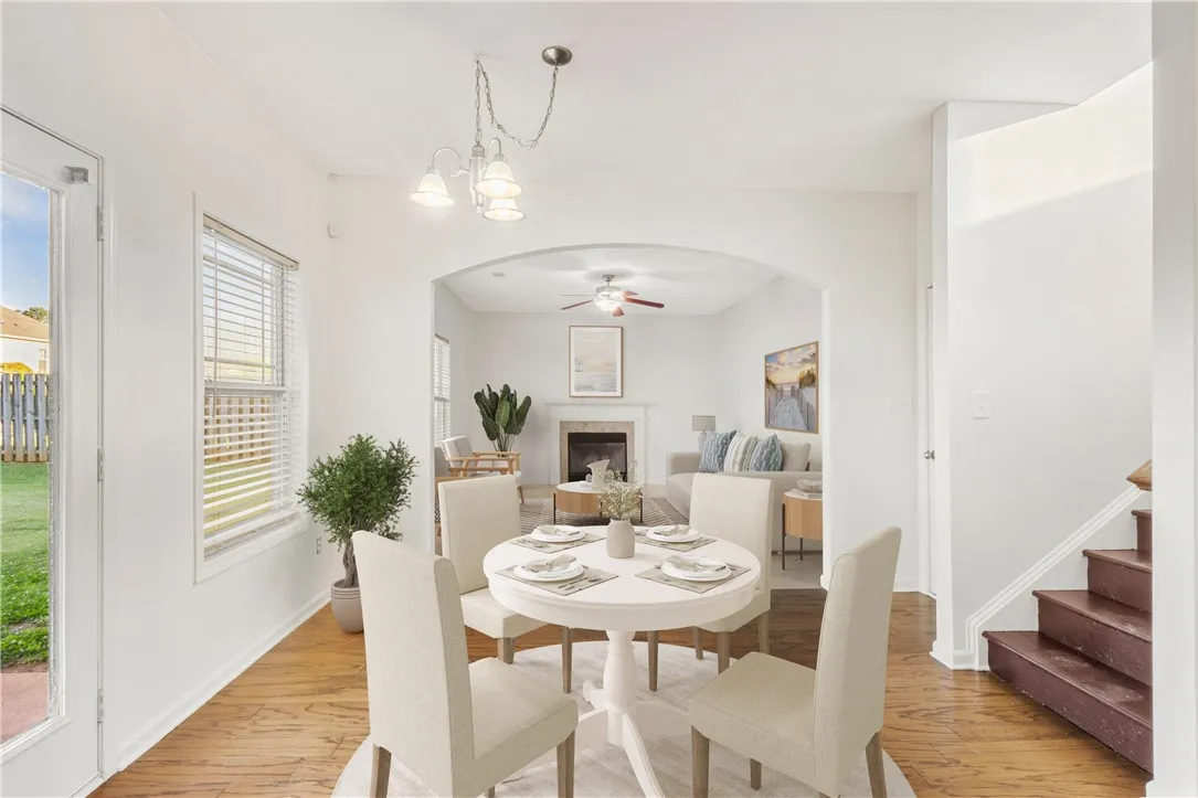 An inviting dining area flows into a bright living space, perfect for everyday living.
