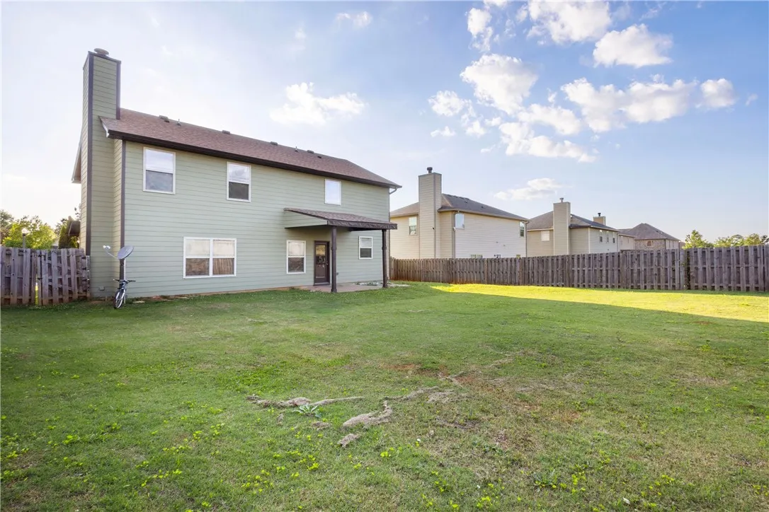 This spacious yard offers ample outdoor living space, perfect for leisure and recreation.