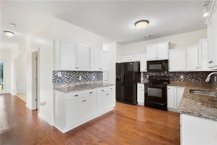 Bright and inviting kitchen with ample counter space and modern appliances.