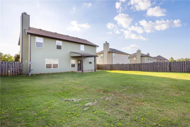 This spacious yard offers ample outdoor living space, perfect for leisure and recreation.