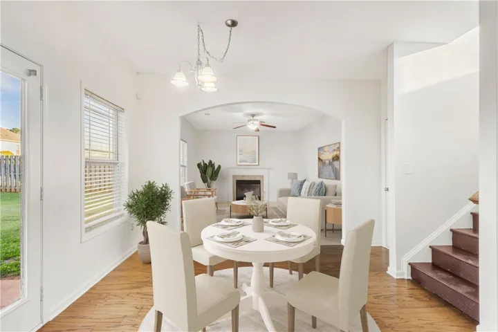 An inviting dining area flows into a bright living space, perfect for everyday living.