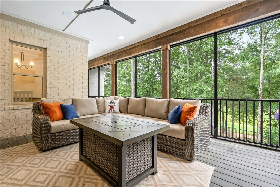 An inviting screened porch provides a serene escape, perfect for enjoying peaceful outdoor moments.