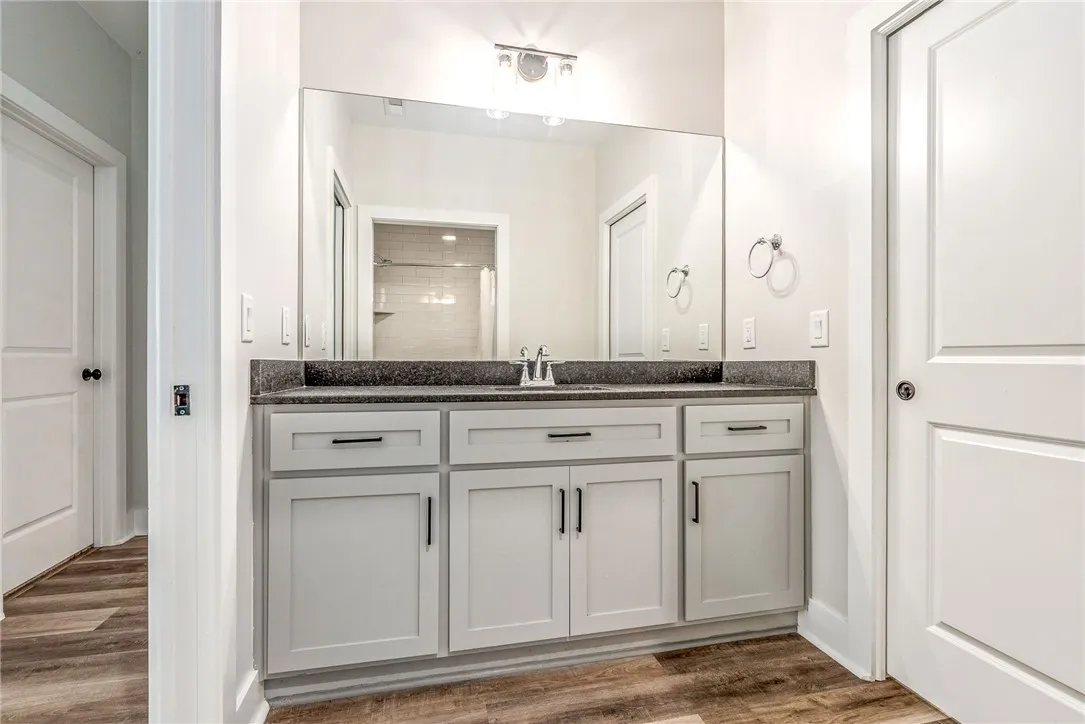 A well-appointed vanity with a sleek countertop and abundant storage.