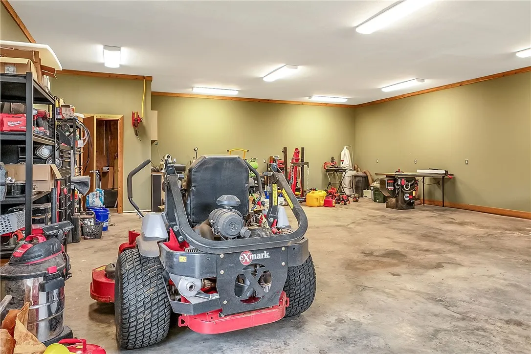 A spacious and practical garage provides ample room for tools and equipment.
