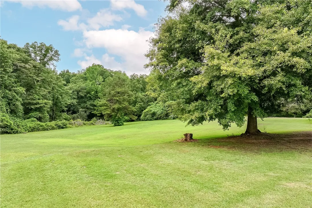 A verdant expanse of land offers a serene backdrop for building your dream estate.
