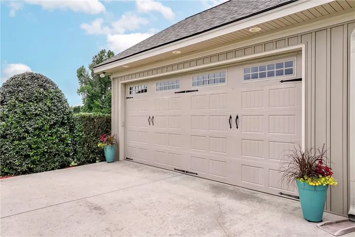 Double garage doors complement the home's exterior, offering practical access and curb appeal.