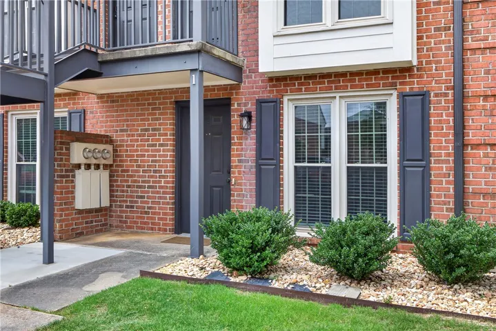 A classic brick exterior with tasteful landscaping welcomes you home.