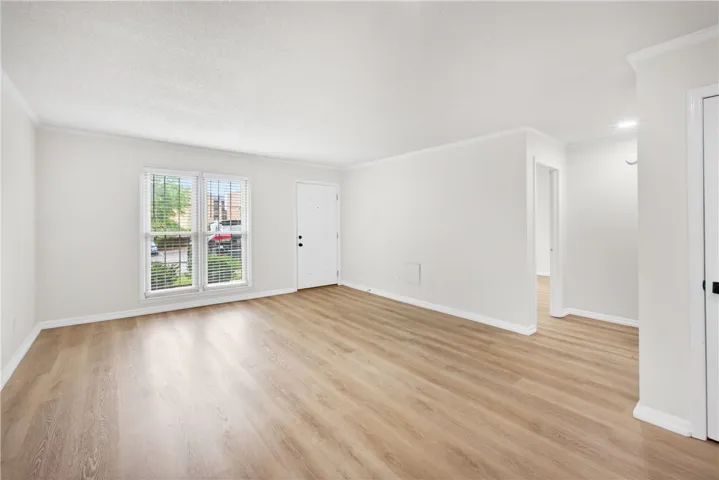 Luminous living space featuring durable laminate flooring and inviting natural light.