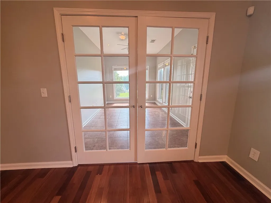 French doors into a second bonus room/sunroom that could be used in a variety of different ways.