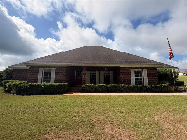A classic brick exterior offers timeless curb appeal and low-maintenance landscaping.