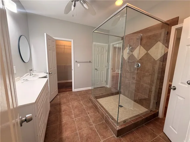 Two walk-in closets, a separate toilet room, and a linen closet.