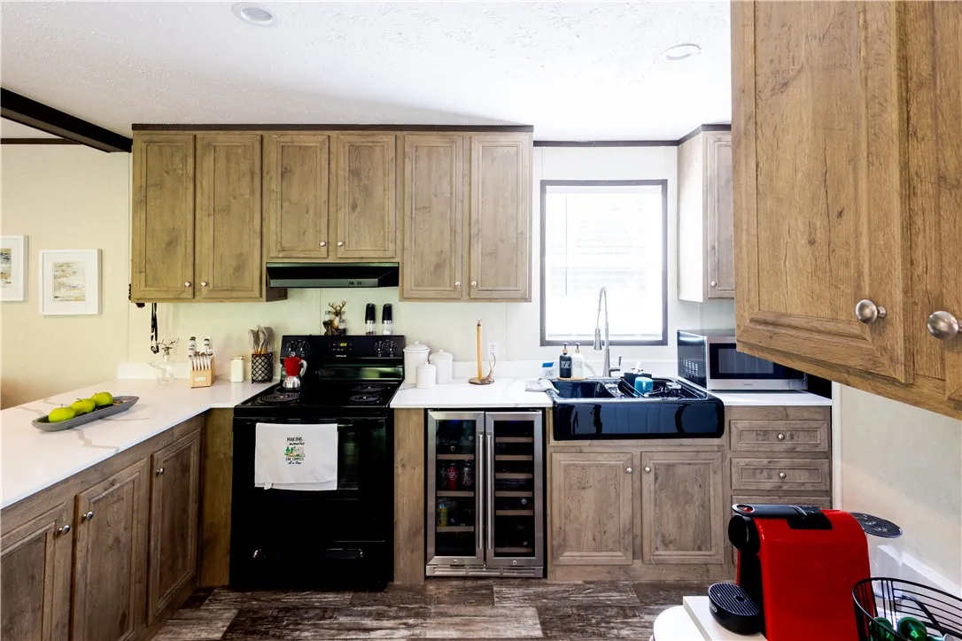 A well-appointed culinary space featuring ample cabinetry and essential appliances.