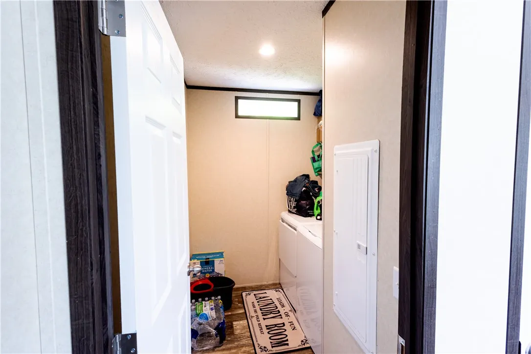 A well-appointed laundry room featuring modern appliances and a practical layout.