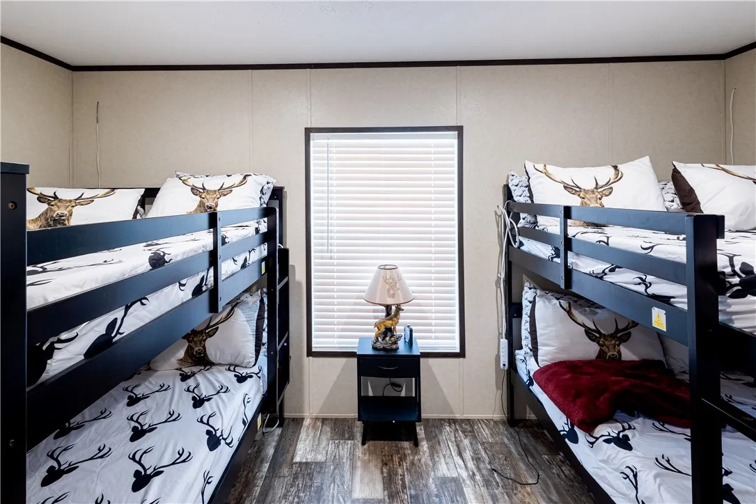 Bunk beds provide efficient sleeping arrangements in this functional space.