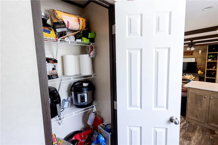 Functional kitchen pantry with convenient shelving provides ample storage solutions.