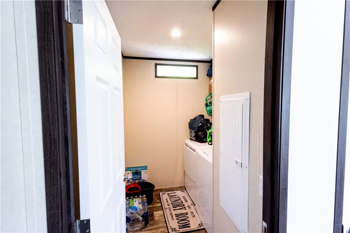 A well-appointed laundry room featuring modern appliances and a practical layout.
