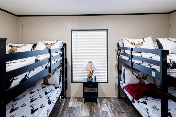 Bunk beds provide efficient sleeping arrangements in this functional space.