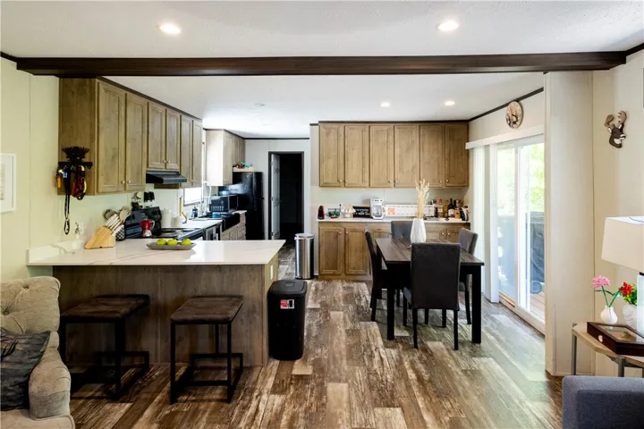 An open-concept living space highlights a well-appointed kitchen and dining area.