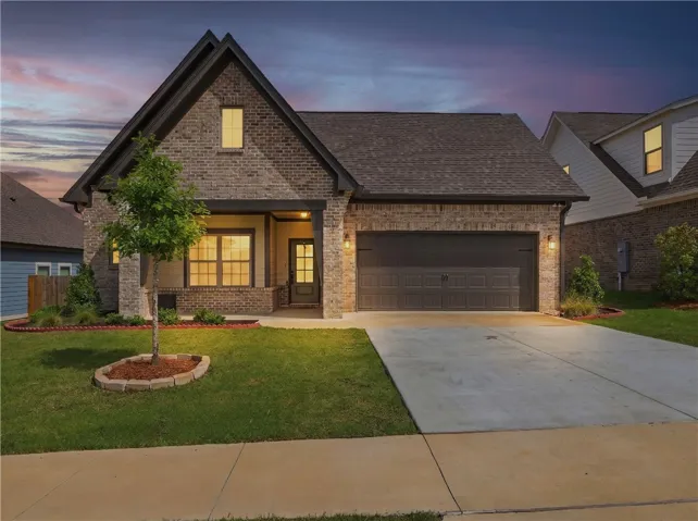 A well-maintained lawn and sturdy brick exterior welcome you to this charming single-family home.