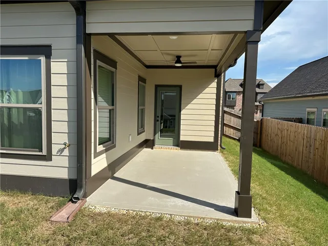 A shaded patio extends outdoor living, perfect for relaxation and gatherings.
