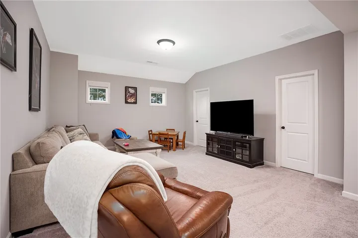 A well-lit and comfortable living area provides ample space for relaxation and entertainment.