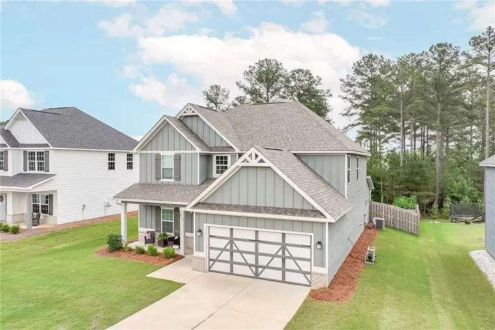 A classic facade with a covered porch offers inviting curb appeal.
