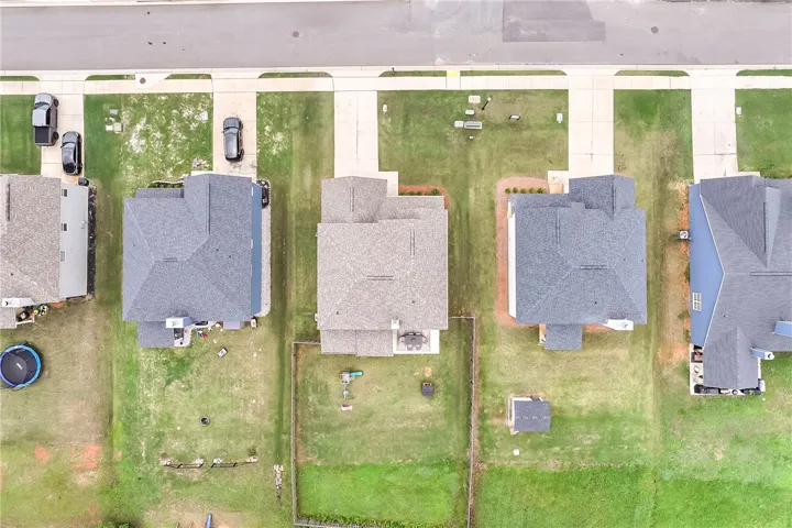 An aerial perspective reveals well-maintained properties with spacious yards and accessible driveways.