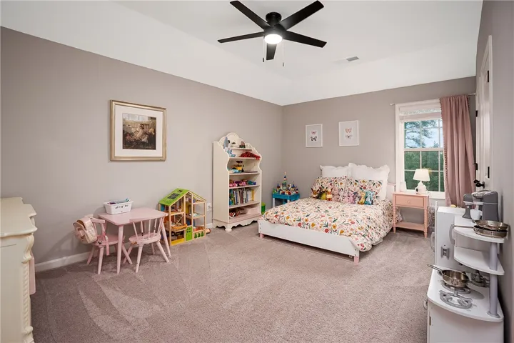 This room offers ample play space and a window for natural illumination.