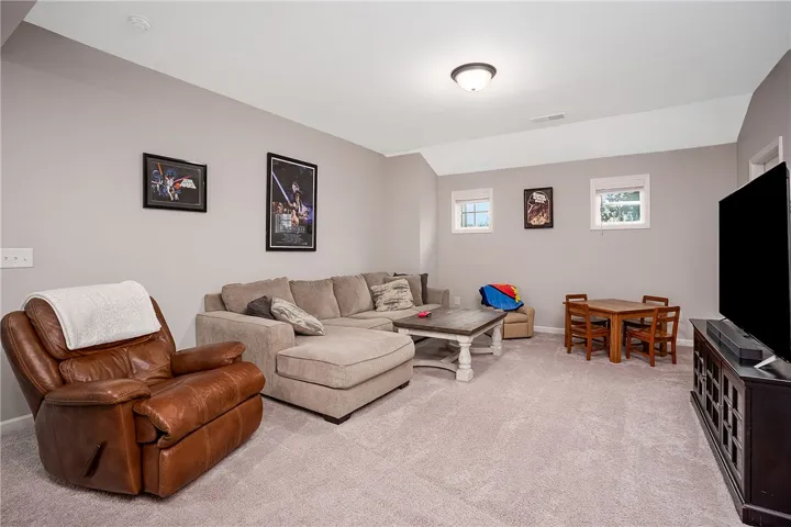 A well-lit casual area provides a comfortable space for relaxation and entertainment.