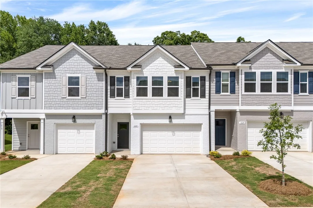 The townhomes feature well-maintained grounds and convenient individual garages.