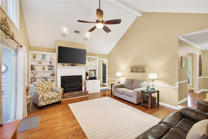 A comforting living area with a fireplace and wood flooring, perfect for unwinding.
