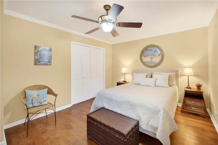 Hardwood floors and ample storage create a comfortable and organized personal retreat.