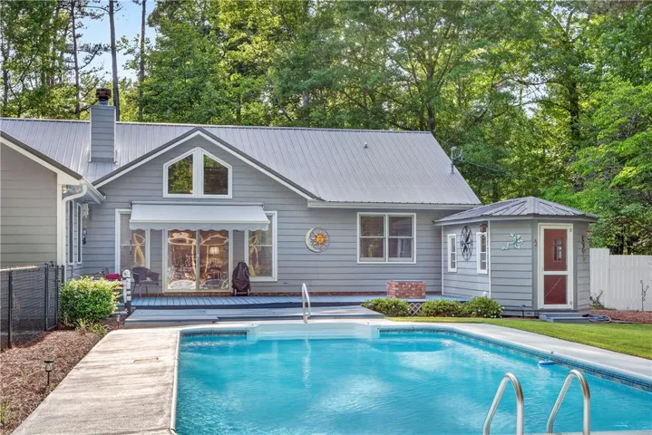 A private pool with a spacious deck area awaits, perfect for outdoor entertaining.