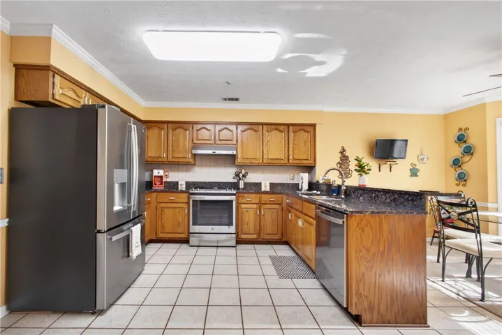 Prepare meals with ease in this well-appointed kitchen featuring a convenient breakfast bar.