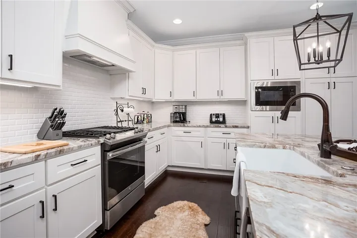 A well-appointed kitchen showcasing elegant cabinetry and a convenient layout.