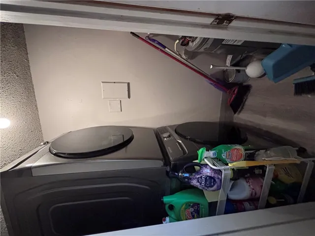 Functional laundry appliances neatly arranged in a dedicated space, optimizing utility.