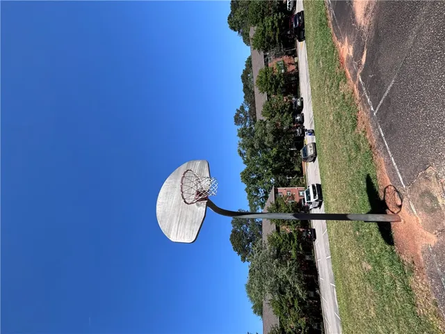 An outdoor basketball court provides recreational opportunities.