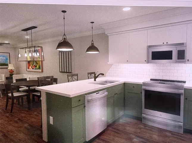 Prepare meals in a kitchen featuring stainless steel appliances and abundant counter space.
